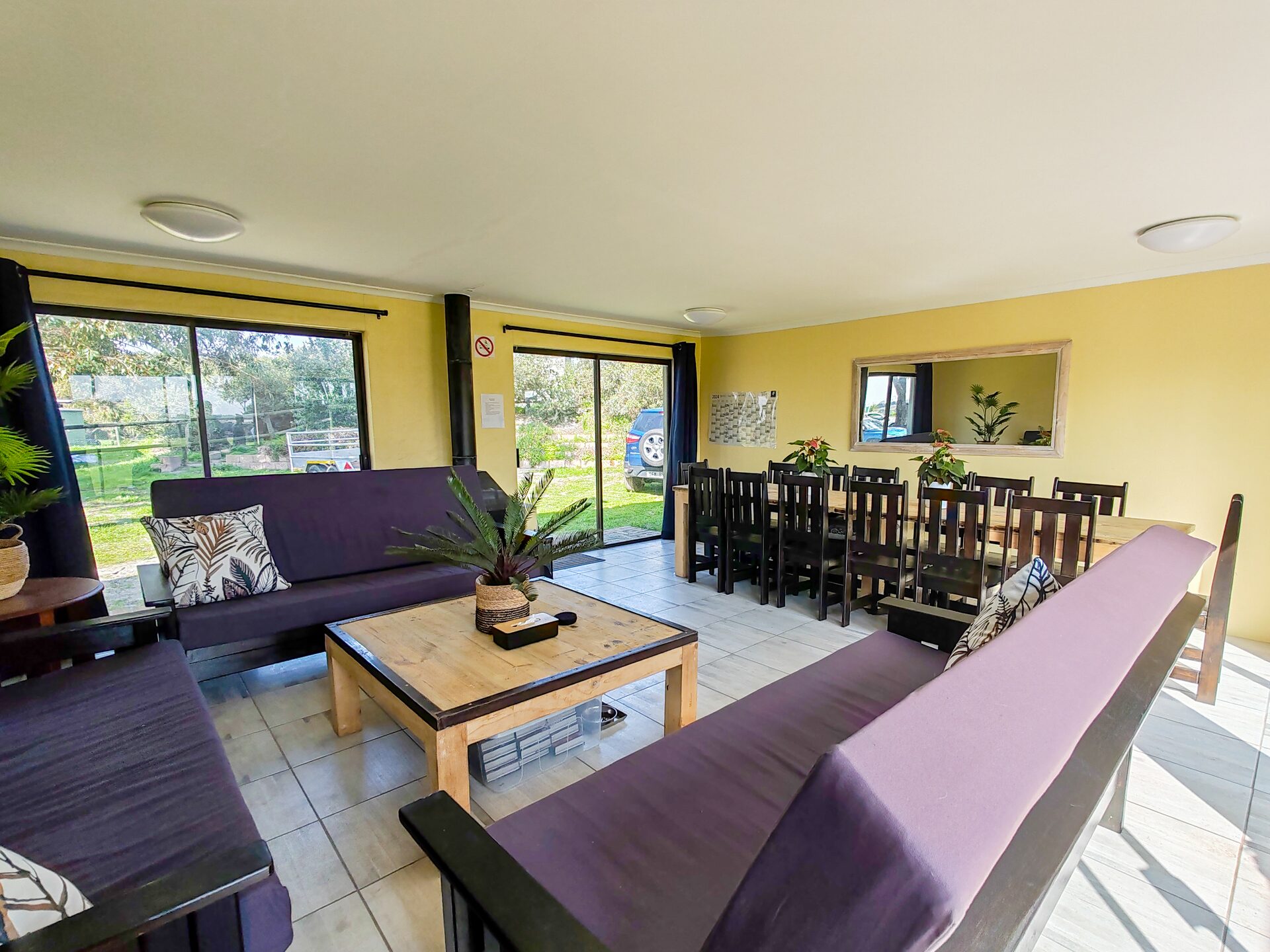 Shared dining area with tables and windows